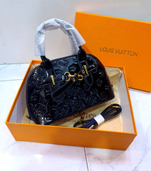 Alma shining Handbags