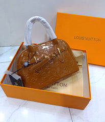 Alma shining Handbags